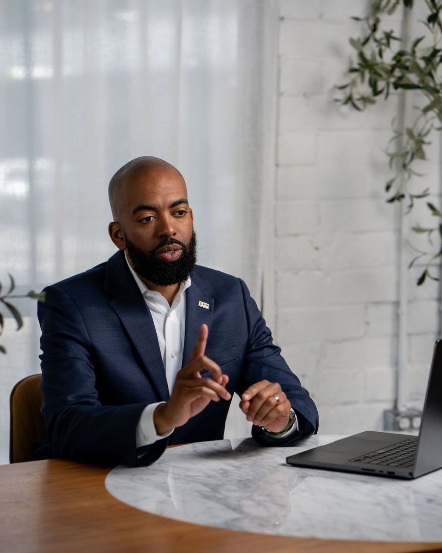 Markell Bryant reviewing a client plan at his desk